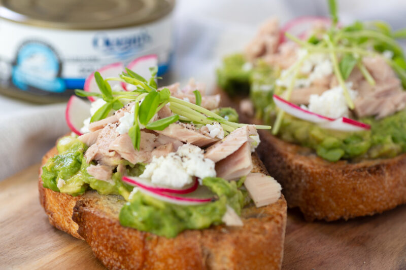 Tuna Avocado Toast with thinly sliced radish and feta crumbles